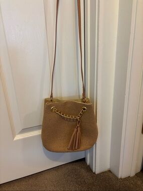 Tan Woven Crossbody Bucket Bag with Gold Chain & Tassel Accent